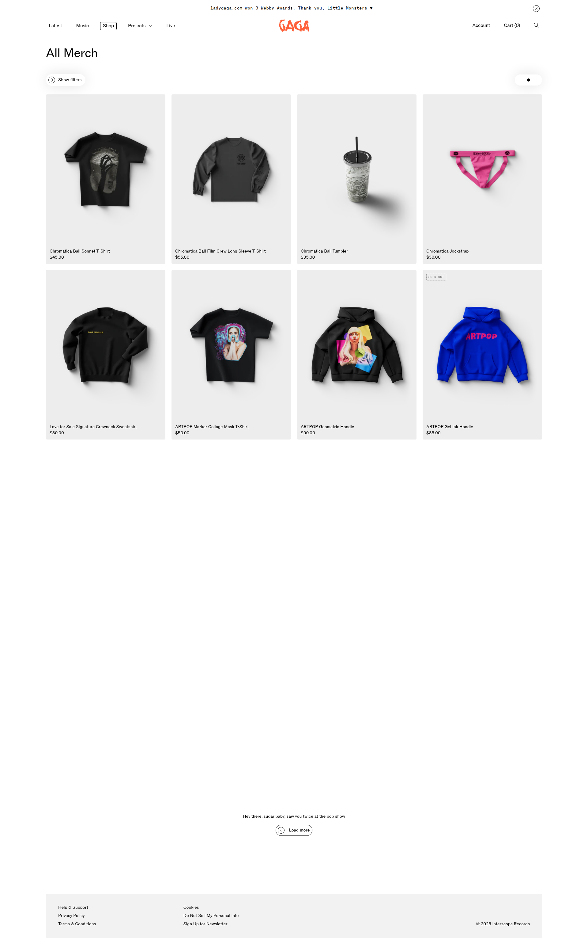 Lady Gaga - This is a merchandise listing page displaying a grid of 8 products including t-shirts, hoodies, a tumbler, and jockstrap, each with product images, names, and prices. The page has a clean layout with filtering options and navigation elements.
